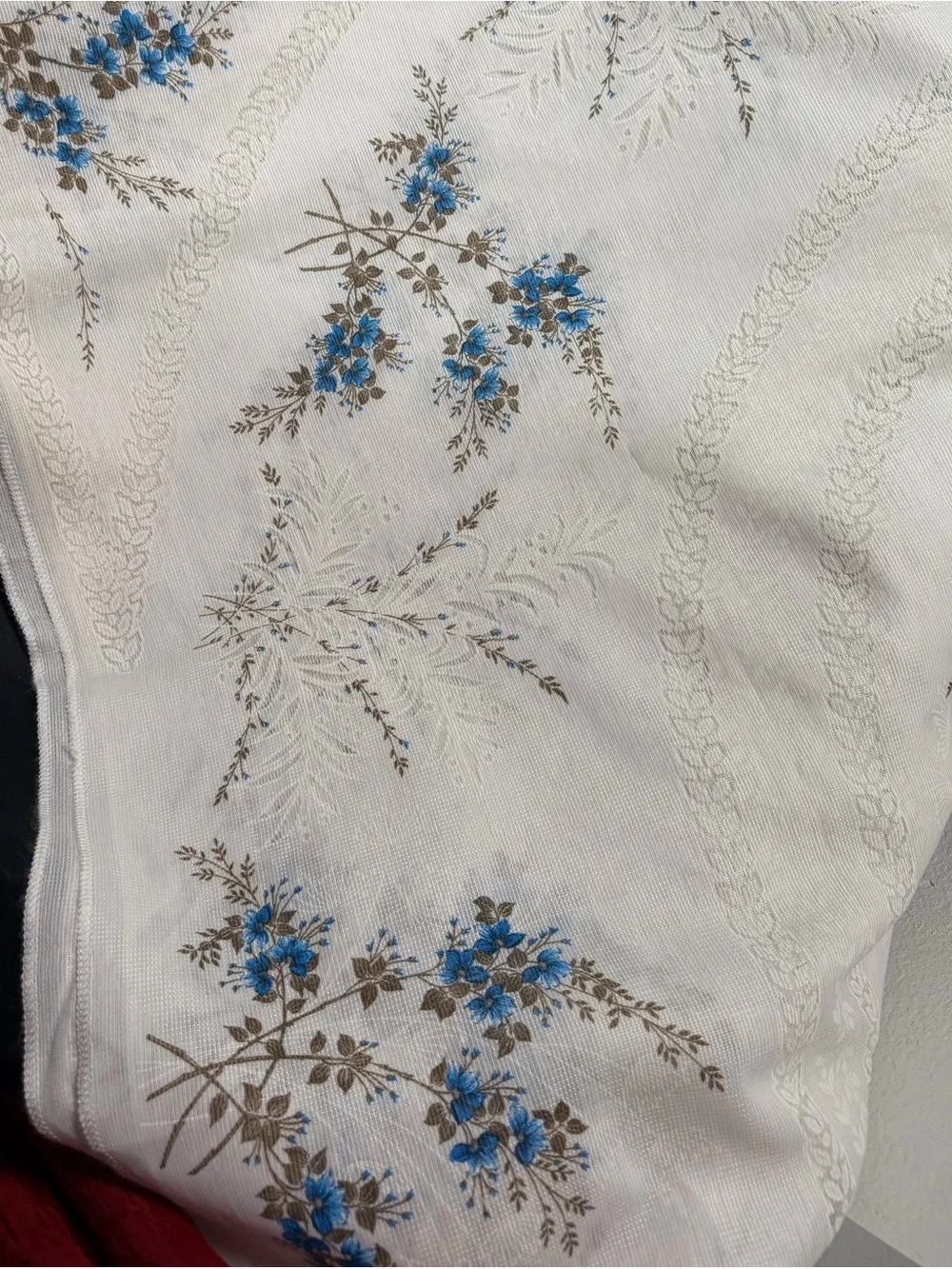 Vintage White Floral tablecloth with Blue Flowers fits a long rectangular table.
